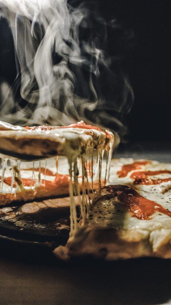 Hot, steaming pizza.