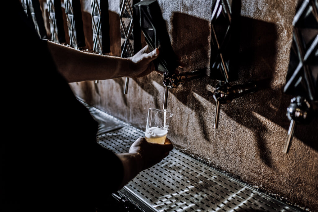 Bartender pouring draught beer.